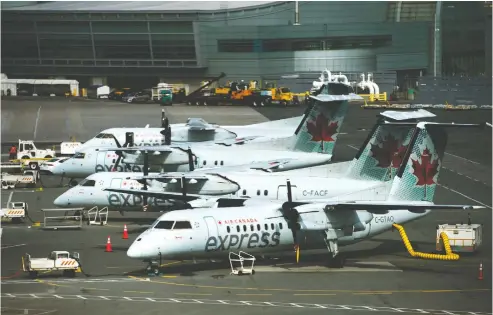  ?? NATHAN DENETTE / THE CANADIAN PRESS ?? Air Canada planes sit on the tarmac at Pearson Internatio­nal Airport in Toronto on Wednesday, April 8, 2020.