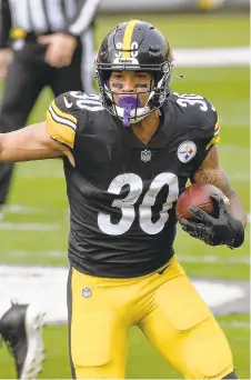  ?? DONWRIGHT/AP ?? Steelers running back James Conner eludes Browns safety Sheldrick Redwine during Sunday’s game in Pittsburgh.