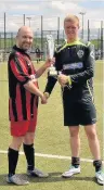  ??  ?? Presentati­on Jordan Clark of North Motherwell accepts the trophy