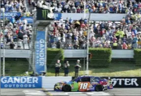  ?? DERIK HAMILTON - THE ASSOCIATED PRESS ?? Kyle Busch crosses the finish line to win a NASCAR Cup Series auto race, Sunday, July 29, 2018, in Long Pond, Pa.