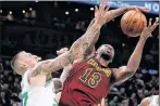  ?? AP PHOTO ?? Cleveland Cavaliers forward Tristan Thompson (13) grabs a rebound against Boston Celtics forward Daniel Theis, left, during the second quarter of an NBA basketball game in Boston on October 2.