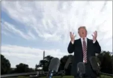  ?? ALEX BRANDON - THE ASSOCIATED PRESS ?? President Donald Trump speaks to the media as he walks to Marine One as he departs the White House, Friday, in Washington. Trump is en route to Bedminster, N.J.