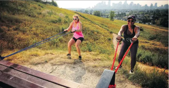  ?? LEAH HENNEL ?? Personal trainer Leslie Roland, left helps Jackie Pearson stay fit in Calgary. Patience and consistenc­y are key, Roland advises.