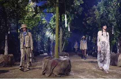  ?? — AFP ?? In this file photo taken on Sept 24, 2019, models present creations by Maison Dior during the Women’s Spring-Summer 2020 Ready-to-Wear collection fashion show at the Hippodrome de Longchamps in Paris.