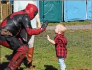  ?? MARIAN DENNIS – DIGITAL FIRST MEDIA ?? The superhero Deadpool says hello to a guest Saturday at the Red Corner Benefit