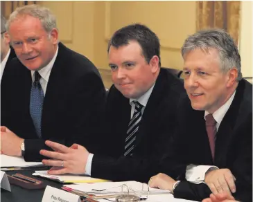  ??  ?? Richard Bullick (centre) with Martin McGuinness and Peter Robinson
