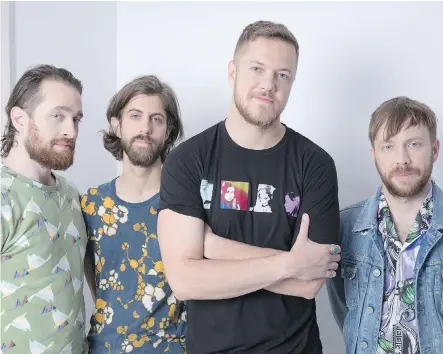  ?? AMY SUSSMAN/THE ASSOCIATED PRESS ?? Imagine Dragons members Daniel Platzman, left, Wayne Sermon, Dan Reynolds and Ben McKee are delighted by their latest album release Evolve, which is lighter, more vibrant and less “produced” than previous albums.