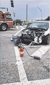  ?? CONTRIBUTE­D BY BOYNTON BEACH POLICE ?? A 2017 Toyota Camry suffffered extensive damage after it collided with a Boynton Beach assistant chief’s Chevrolet Tahoe on Tuesday.