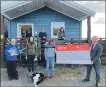  ?? ?? Macaulay College receiving their GreenSkies Community Fund cheque from CEO of Loganair Jonathan Hinkles.