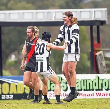  ?? ?? Jack Hazendonk and Mitch De Kleuver celebrate the latter’s goal for Poowong.