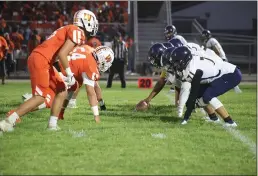  ?? CARLOS GUERRERO — DAILY DEMOCRAT ?? The Wolves’ defense line up for a play during the second quarter of Woodland High Schools game against River City Friday night.