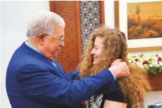  ?? Reuters ?? Palestinia­n President Mahmoud Abbas meets with Ahed Tamimi after she was released from an Israeli prison.