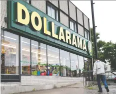  ?? PAUL CHIASSON/THE CANADIAN PRESS ?? Dollarama Inc.’s new store openings in the third quarter affected the company’s profit margins.