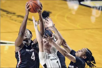  ?? Mark Zaleski / Associated Press ?? South Carolina’s Aliyah Boston, left, grabs a rebound above Vanderbilt’s Enna Pehadzic.