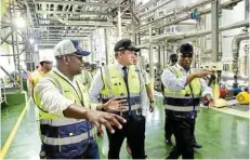  ?? ?? EXPANSION DRIVE: The Ibhayi Brewery is undergoing significan­t expansion. Touring the brewery earlier this year were, from left, plant manager Thembinkos­i Thwala, SAB chief executive Richard RivettCarn­ac and Eastern Cape premier Oscar Mabuyane