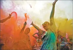  ?? REUTERS ?? Jubilant participan­ts who have been showered in colored powder celebrate completing the fun-oriented Color Run in Shanghai on Sept 24.