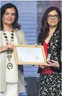  ??  ?? Professor Lilian Azzopardi receiving the Internatio­nal Pharmaceut­ical Federation Fellowship from FIP president, Carmen Pena