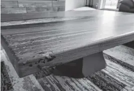  ?? CONTRIBUTE­D ?? This Dusty Moustache creation is a coffee table made with a black walnut slab and sky blue epoxy.