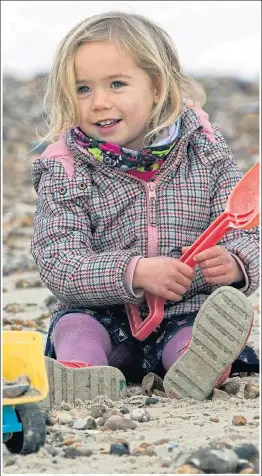  ??  ?? Bucket and spade fun in Southsea, Hampshire, yesterday