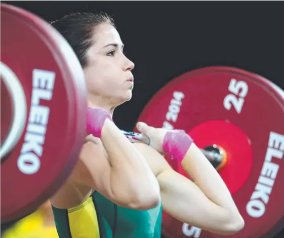  ??  ?? Former Gold Coaster Tegan Napper has high hopes of Commonweal­th Games weightlift­ing success despite her small frame.