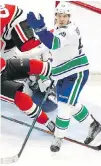  ??  ?? Canucks right winger Nikolay Goldobin gestures in front of the Chicago net.