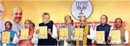  ??  ?? BJP President Amit Shah, Chhattisga­rh Chief Minister, Raman Singh and party leaders during the release of the party’s manifesto for Chhattisga­rh Assembly elections in Raipur on Saturday