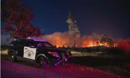  ?? ?? The 2020 Zogg fire originated east of Redding, California, when a tree fell on power lines. Photograph: Ethan Swope/AP