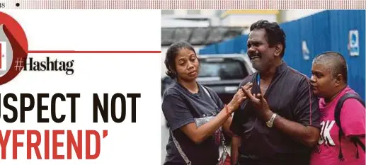  ?? PIC BY ROSDAN WAHID ?? D. Tharani’s father, M. Devarajoo (centre), being consoled by his daughters outside the Universiti Malaya Medical Centre mortuary in Petaling Jaya yesterday.