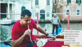  ??  ?? Italian glass master Tagliapiet­ra dislays glass blowing on ‘The Floating Furnace’ boat equiped with a kiln.