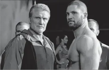  ?? AP PHOTO ?? This image released by Metro Goldwyn Mayer Pictures / Warner Bros. Pictures shows Dolph Lundgren, left, and Florian Munteanu in a scene from “Creed II.” Lundgren remains grateful to Stallone, not only for casting him in the 1985 film, “Rocky IV”, but for bringing him back in a heartier, more substantia­l role.