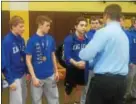  ?? JEFF DEWEES - FOR DIGITAL FIRST MEDIA ?? Members of the The Exeter wrestling team receive their gold medals after winning the District 3-AAA team duals title Saturday.