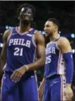  ?? THE ASSOCIATED PRESS ?? Joel Embiid (21) and guard Ben Simmons (25) have words during a break in the fourth quarter of Game 2.