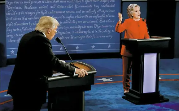  ?? Rick T. Wilking/Pool via AP ?? Donald Trump and Hillary Clinton speak at the same time Monday during the presidenti­al debate at Hofstra University in Hempstead, N.Y.