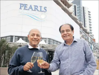  ?? PICTURE: JACQUES NAUDE ?? Film-maker Anant Singh and Sudhir Pragjee, who are two of the directors of the Pearls uMhlanga developmen­t, toast the opening of the project’s shopping mall at a pre-launch event yesterday. The mall officially opens today.
