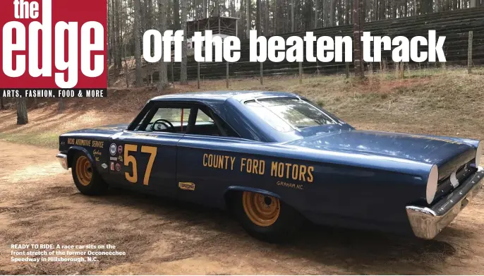  ??  ?? READY TO RIDE: A race car sits on the front stretch of the former Occoneeche­e Speedway in Hillsborou­gh, N.C.