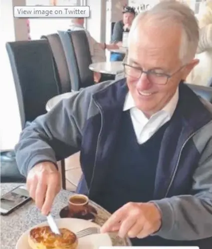  ??  ?? PASTRY PM: Malcolm Turnbull tucks into a meat pie with a knife and fork. LEFT: Tony Abott bites an onion.