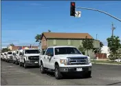  ?? ?? The convoy honoring Firefighte­r Darin Banks makes its way up Walnut Street in Red Bluff Thursday.