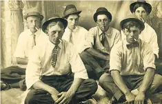  ??  ?? Six men in hats and ties smoking cigarettes, an anonymous photograph from 1905