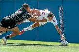  ?? PHOTOSPORT ?? Ryan Hall scores for England during their win over New Zealand in Denver in June.