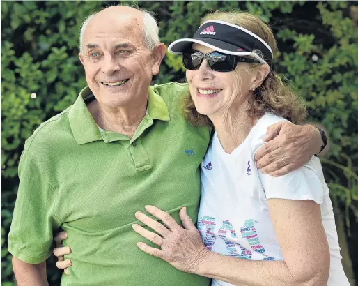  ?? PHOTO: PETER MCINTOSH ?? Still running . . . Roger Robinson and wife Kathrine Switzer in Dunedin yesterday.