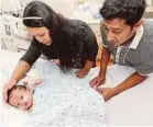  ??  ?? Lachamanan Teck Bahadur and his wife, Ana Marfuah, with their son Shailendra Bahadur Lachamanan at Gleneagles Hospital in Kuala Lumpur on Tuesday.