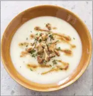  ?? CARL TREMBLAY/AMERICA’S TEST KITCHEN VIA AP ?? This undated photo provided by America’s Test Kitchen in October 2018 shows creamy cauliflowe­r soup in Brookline, Mass. This recipe appears in the cookbook “Cooking at Home with Bridget and Julia.”