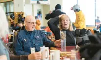  ?? ?? Wild old Bunch members Dave Wahlstrom and Anne Kronawitte­r join others in the group March 13 at Alf’s Restaurant after morning runs.