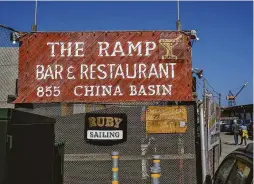  ?? ?? A sign for The Ramp restaurant on San Francisco Bay. The Port of San Francisco is threatenin­g to evict the business and the nearby boatyard.