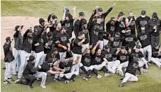  ?? NAM Y. HUH/AP ?? The Marlins celebrate after defeating the Cubs in Game 2 on Friday.