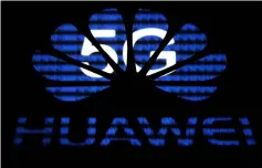  ??  ?? A 3-D printed Huawei logo is seen in front of displayed 5G words in this illustrati­on. — Reuters photo