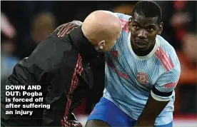  ?? ?? DOWN AND OUT: Pogba is forced off after suffering an injury