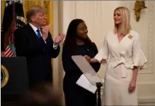  ?? AP PHOTO/ EVAN VUCCI ?? President Donald Trump and survivor Bella Hounakey applaud Ivanka Trump during an event on human traffickin­g in the East Room of the White House, in a Friday, Jan. 31 file photo, in Washington.