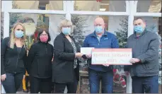  ?? (Photo: Katie Glavin) ?? Aoife Kearne, Catherine O’Keeney and Goretti Fitzgerald of Jim Bermingham’s in Fermoy, pictured presenting a cheque to Jimmy Corcoran and Noel McCarthy of the Fermoy Christmas Lights Committee.