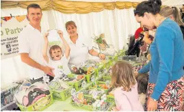  ??  ?? Children enjoy filling Fab Party Bags at Southport Food and Drink Festival